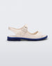 Side view of white Melissa Bae white sandal with a blue sole.