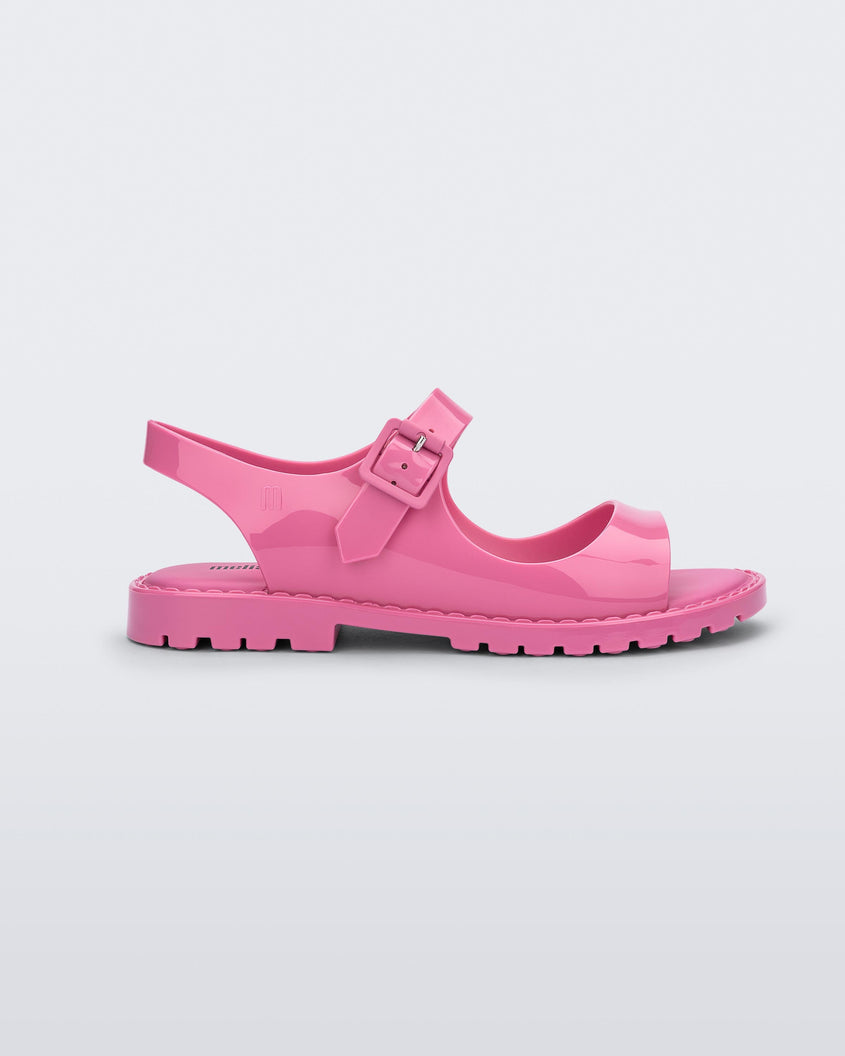 Side view of pink Melissa Bae sandals.