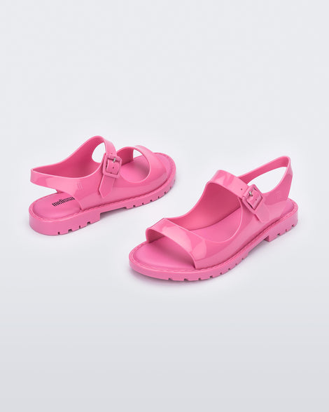 Angled view of a pair of pink Melissa Bae sandals.