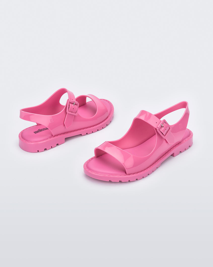 Angled view of a pair of pink Melissa Bae sandals.