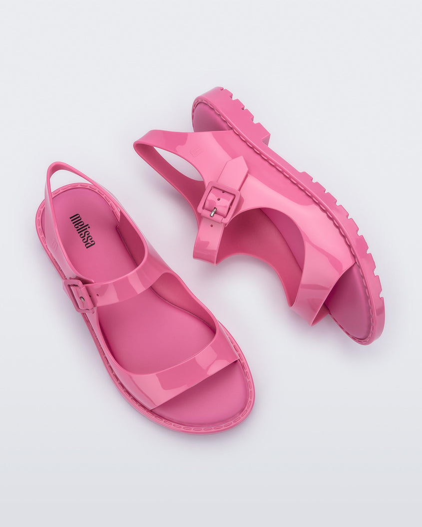 Top and side view of a pair of pink Melissa Bae sandals.
