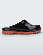 Side view of a black Melissa Smart Clog with a black base and an orange/brown sole.