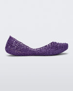 Side view of a purple Melissa Campana flat with an open woven texture.