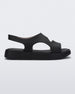 Side view of a black Melissa Franny sandal with straps.