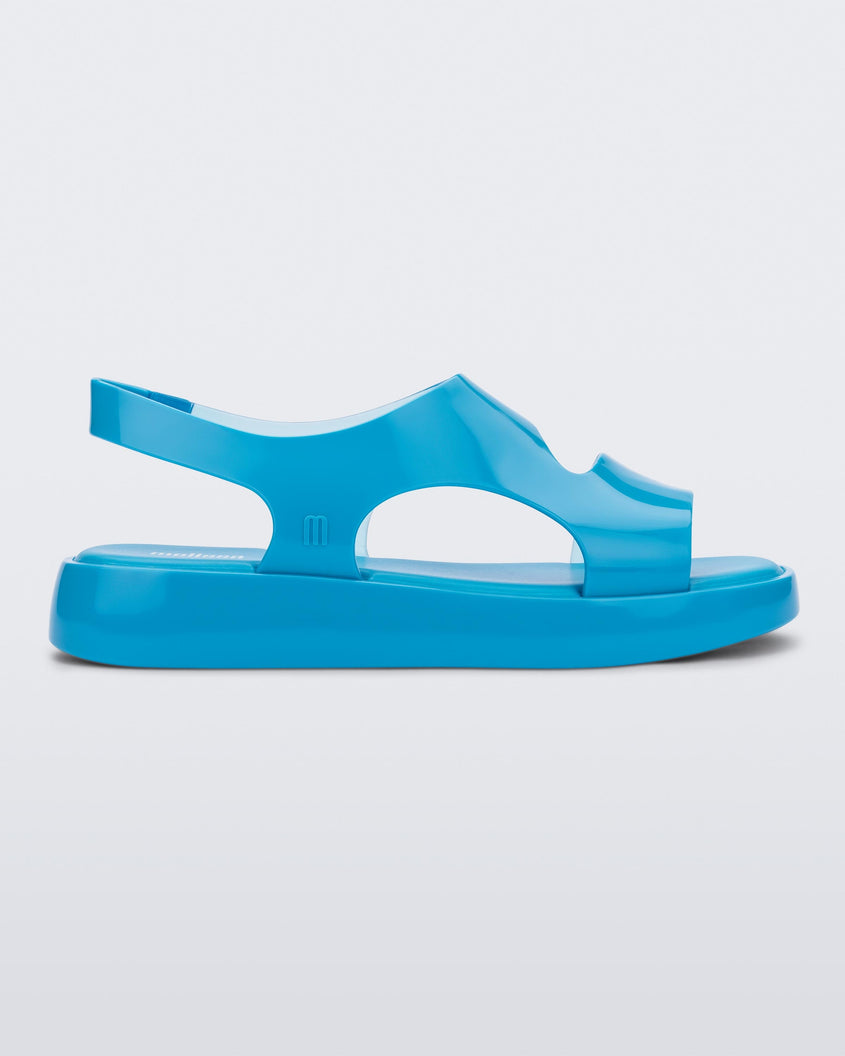 Side view of a blue Melissa Franny sandal with straps.