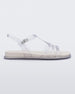 Side view of a clear Melissa Party sandal with back ankle strap and buckle closure.
