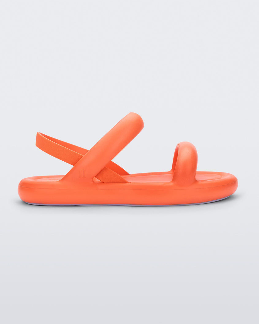 Side view of an orange Melissa Free Bloom Sandal with puffer-like straps.