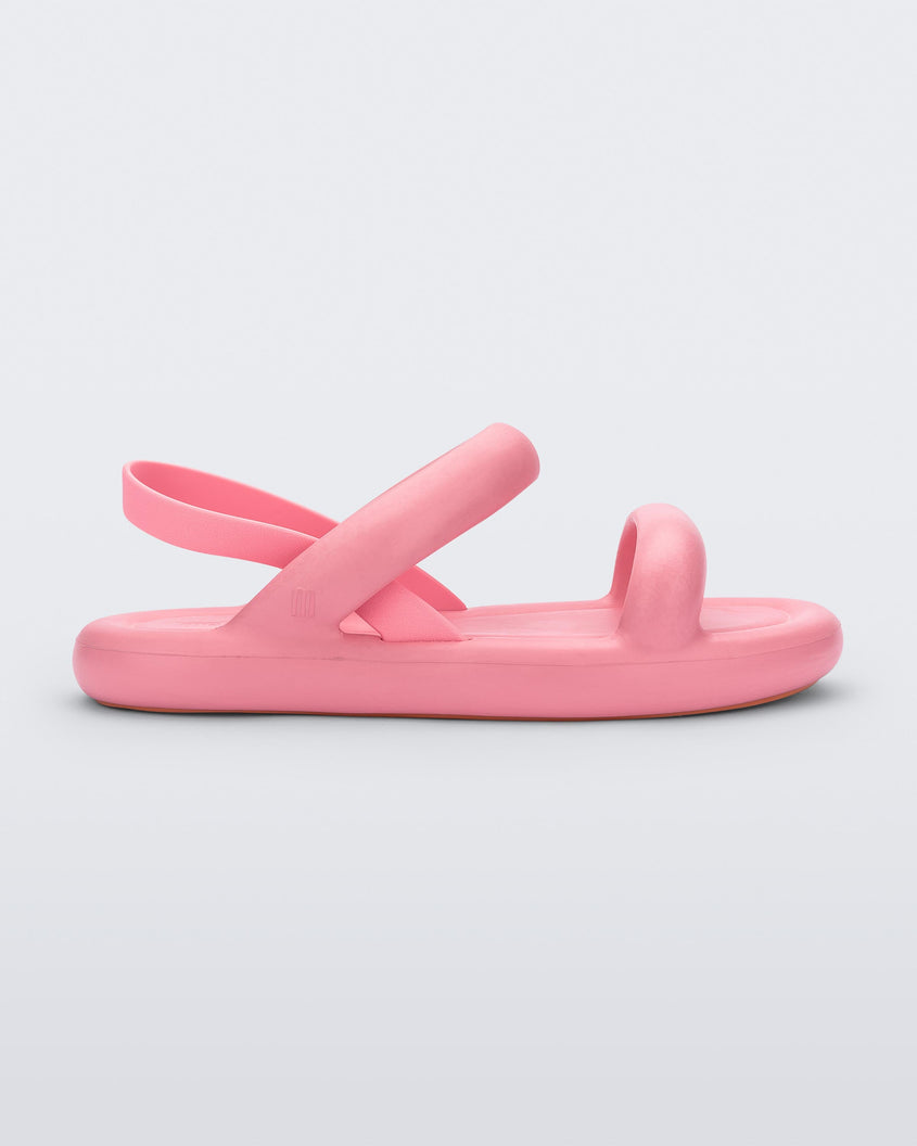 Side view of a pink Melissa Free Bloom Sandal with puffer-like straps.