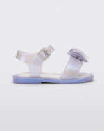 Side view of a pearly blue Mini Melissa Mar Sandal with a heart shaped bow and buckle.