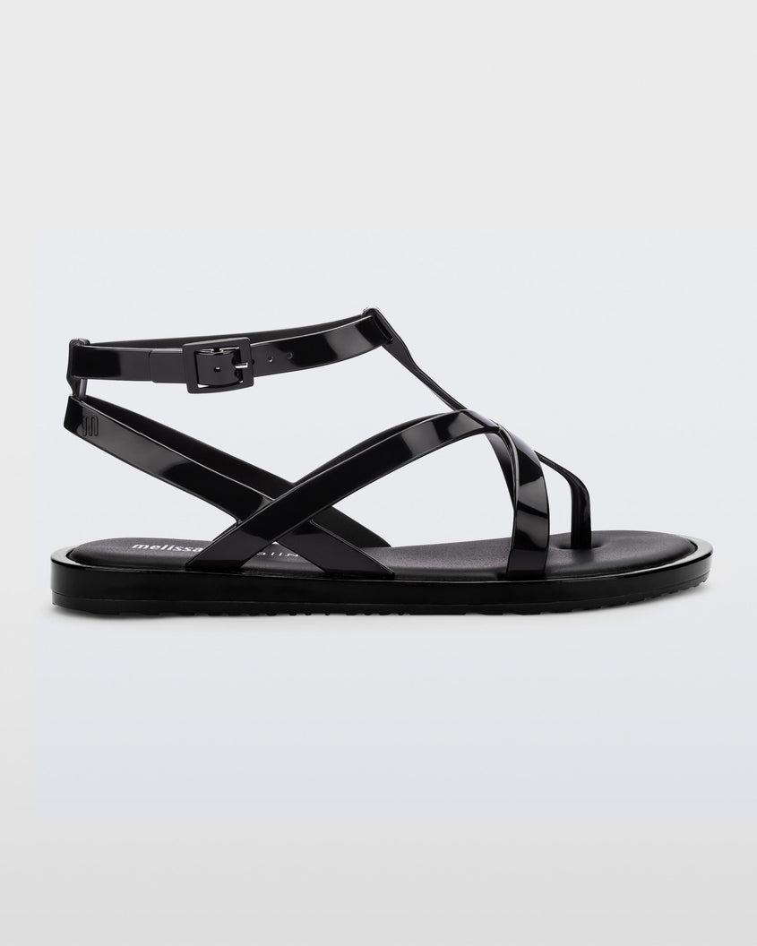 Side view of a black Melissa Cancun sandal with several straps.