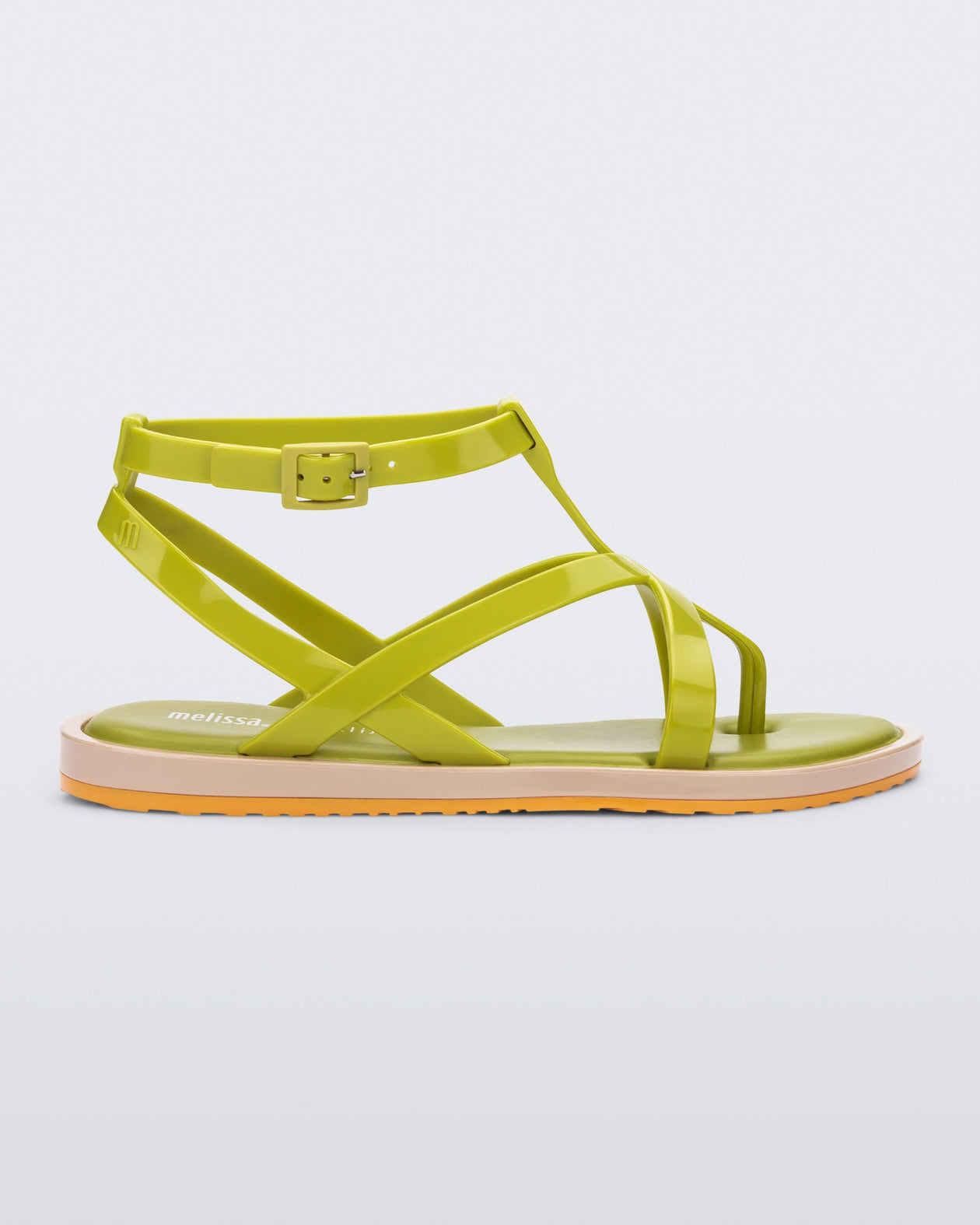 Side view of a green Melissa Cancun sandal with several straps and a beige sole.