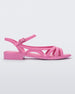 Side view of a pink Melissa Femme Classy sandal with straps and a woven design.