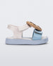 Side view of a blue/white/beige Mini Melissa Jump Candy sandal with a print of cookies on the insole and a plastisol cookie on top of the straps.