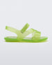 Side view of a green Mini Melissa The Real Jelly Paris slide with three straps and an ankle strap.