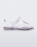 Side view of a clear Mini Melissa The Real Jelly Paris sandal with three front straps and an ankle strap.