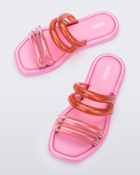 Top view of a pair of pink and transparent pink Melissa Airbubble Slides