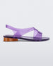 Side view of a purple Melissa The Real Jelly Paris sandal with two front straps, an ankle strap and an orange heel.