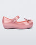 Side view of a pearly pink Mini Melissa Ultragirl Bugs flat with a top strap and a bug detail on the toe.