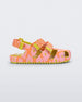 Side view of a Yellow/Orange Mini Melissa Yoyo sandal with orange and pink floral base, 2 front velcro straps, 1 back velcro strap and a yellow sole.