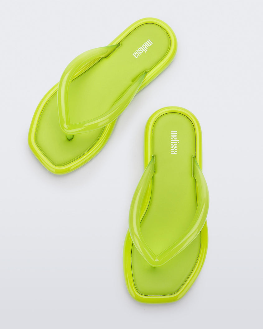 Top view of a pair of green Melissa Airbubble Flip Flops.