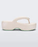 Side view of a beige Melissa Free Platform flip flop with puffer-like straps.