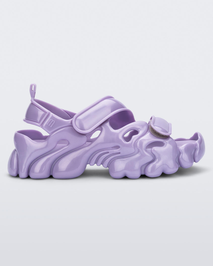 Side view of a Melissa Puff chunky sandal in lilac with velcro straps