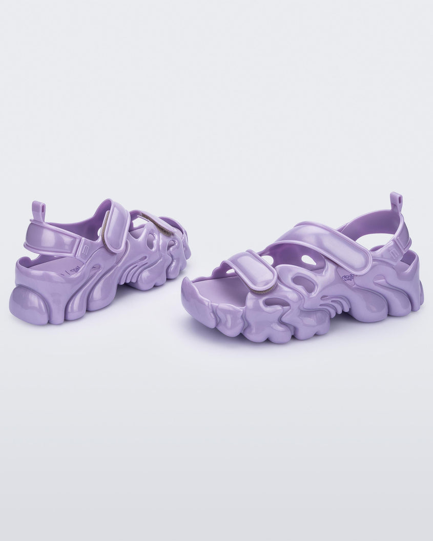 Angled view of a pair of Melissa Puff chunky sandals in lilac with velcro straps