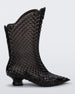 Side view of a clear black Melissa Court Boot with a short heel, heart detail on the front and a checkered pattern texture.