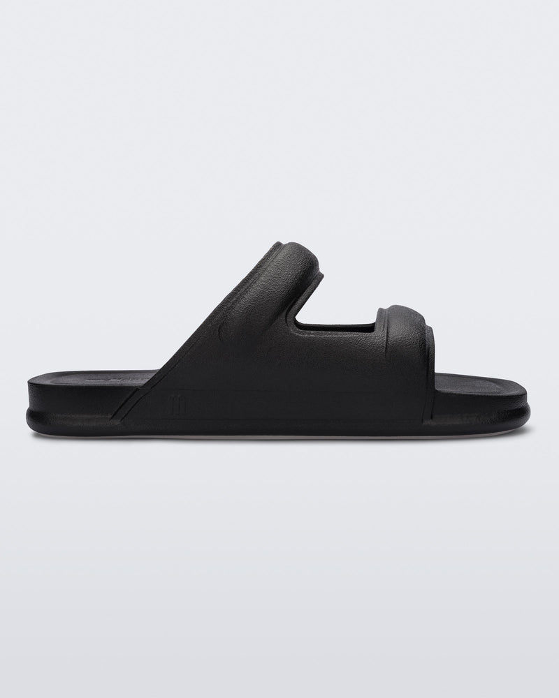 Side view of a black Melissa Free Grow slide with a square cut out on the front.