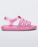 Side view of a pink Melissa Freesherman sandal with pink and clear straps.