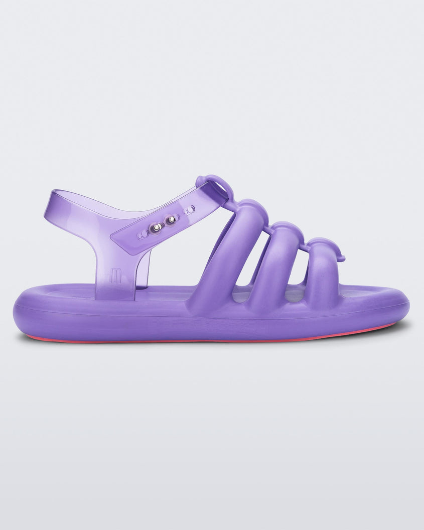 Side view of a lilac Melissa Freesherman sandal with lilac and clear straps.