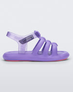 Side view of a lilac Mini Melissa Freesherman with lilac and clear glitter straps.