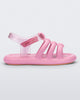 Side view of a pink Mini Melissa Freesherman sandal with pink and clear glitter straps.