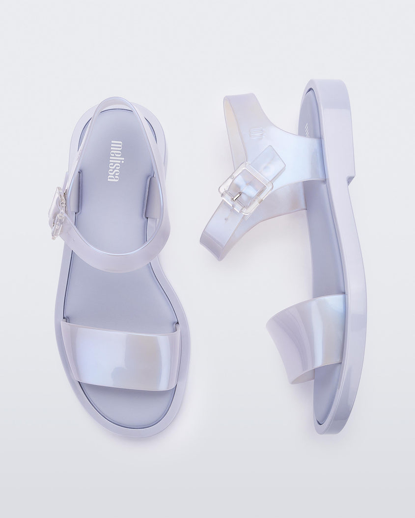 A top and side view of a pair of lilack/blue pearl Melissa Mar Sandals sandals with two straps.