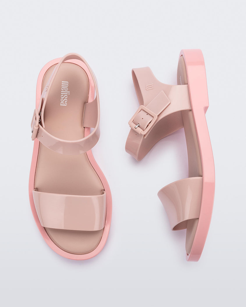 A top and side view of a pair of pink Melissa Mar Sandals with two straps.