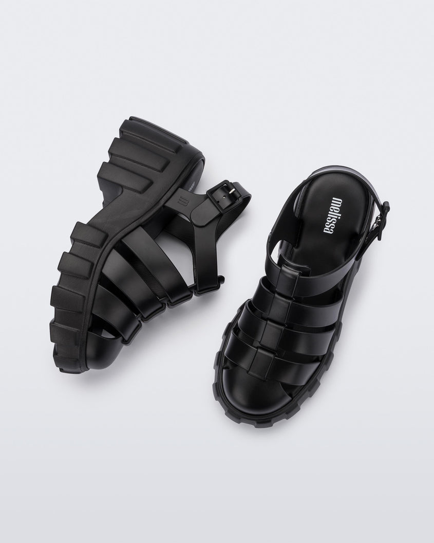 Top and side view of a pair of black Melissa Megan platform heel sandals.