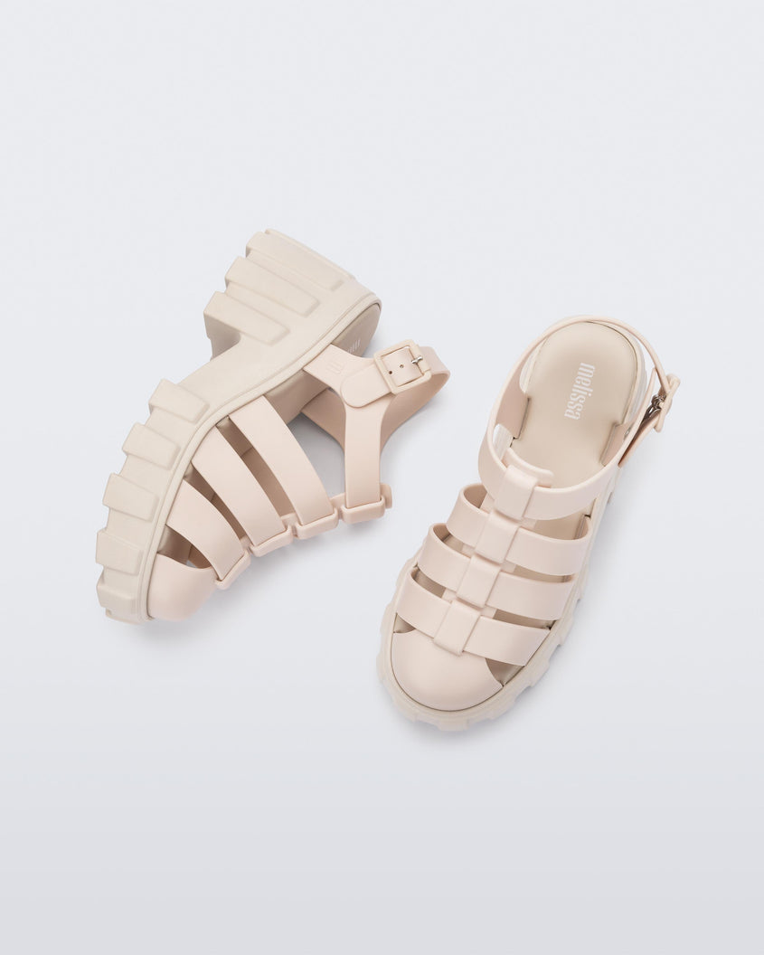 Top and side view of a pair of beige Melissa Megan platform heel sandals.