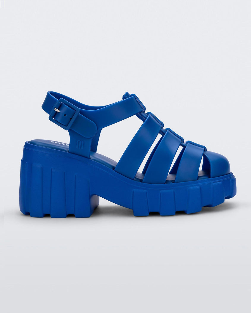 Side view of a blue Melissa Megan platform heel sandal.