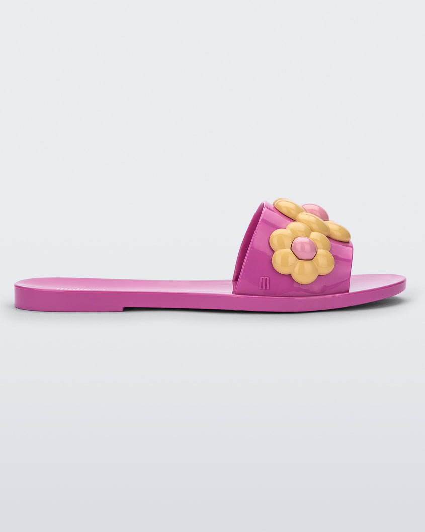 Side view of purple Melissa Babe Spring slide with yellow flowers.