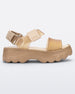 Side view of a beige/gold Melissa platform Kick Off Sandal with two glitter straps.