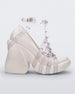 Side view of a White/Clear Melissa Punk Love Heel with a white base and clear straps fastening at a top ankle strap with spike details.