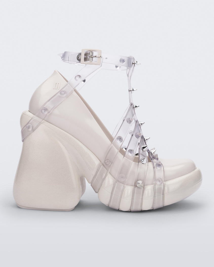 Side view of a White/Clear Melissa Punk Love Heel with a white base and clear straps fastening at a top ankle strap with spike details.