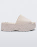 Side view of a beige Melissa Becky platform slide with the Marc Jacob's logo across the sole.