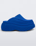 Side view of a blue Melissa Clog with the Marc Jacob's logo across the sole.