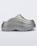 Side view of a silver Melissa Clog with the Marc Jacob's logo across the sole.