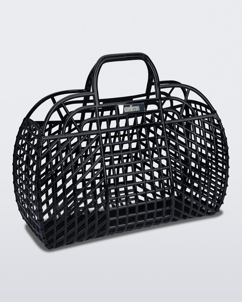 Angled view of a black Refraction bag with handles