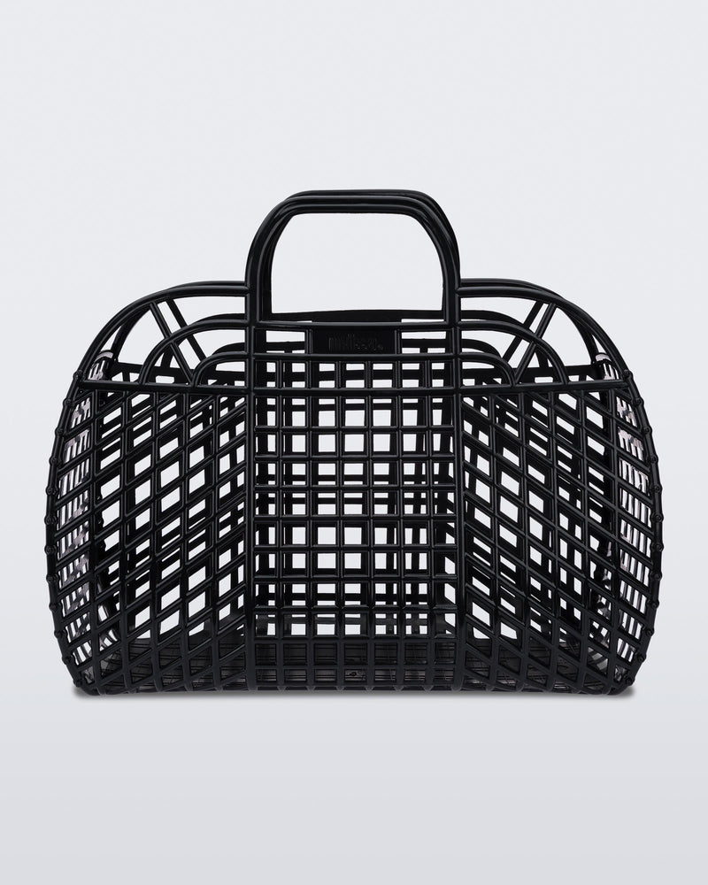 Back view of a black Refraction bag with handles