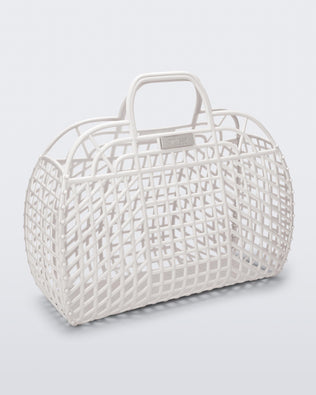 Angled view of a white Refraction bag with handles