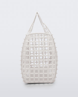 Side view of a white Refraction bag with handles