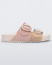 Side view of a Beige/Pink Melissa Cozy slide with two pink and beige straps with a buckle detail.